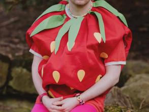 Alex Paxton dressed in a strawberry outfit